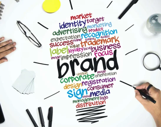 A person analyzes brand identity through creative strategies for business growth & attracts viewers.