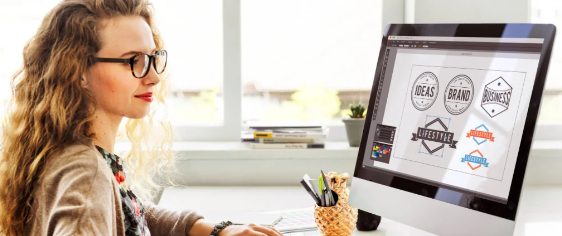 The computer on the woman's desk displayed a prominent logo, creating a work environment for her.