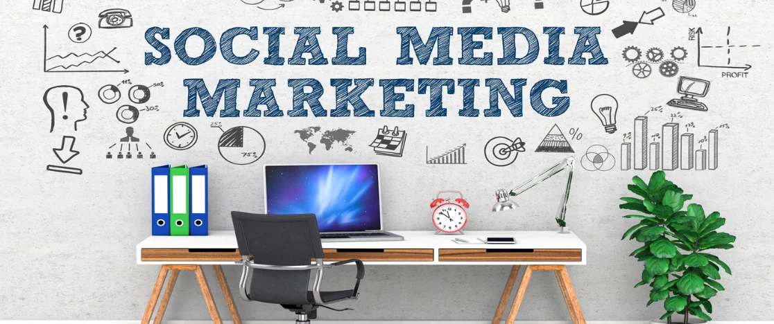 A professional working area with some social media icons, representing social media strategies.